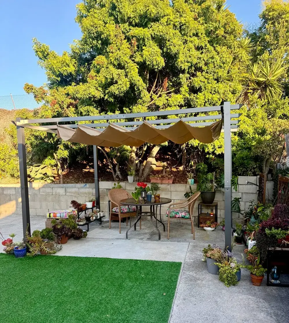 Backyard pergola, artificial turf and pavers in San Diego